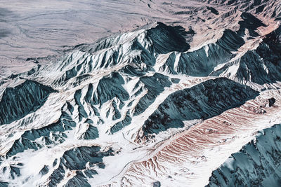 High angle view of glacier on snowcapped mountain