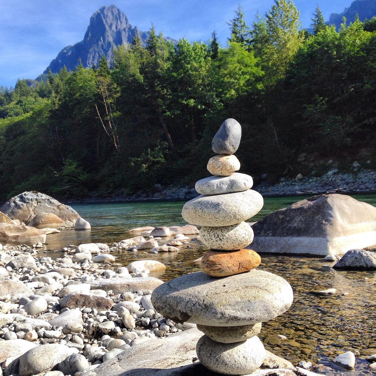 rock - object, water, stone - object, tranquility, stack, balance, tranquil scene, nature, mountain, beauty in nature, sky, scenics, rock, rock formation, stone, lake, tree, pebble, idyllic, day