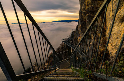 High angle view of steps leading towards cloudscape