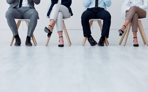 Low section of people walking on floor