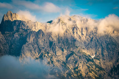 Panoramic view of snowcapped mountains against sky