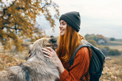 Woman wearing hat in park during winter