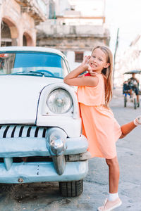 Portrait of a smiling young woman in car