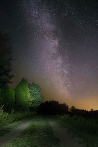 Scenic view of field against sky at night