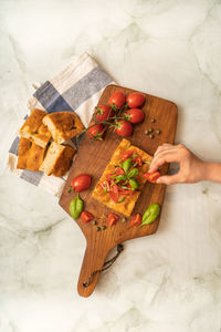 High angle view of person preparing food on cutting board