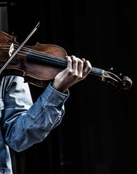 Cropped image of musician playing violin