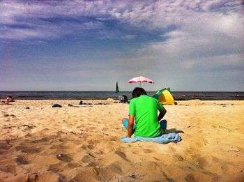 Full length of boy standing on beach