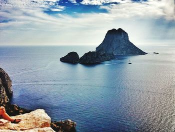 Scenic view of sea against cloudy sky