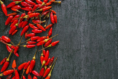 High angle view of red chili peppers on table