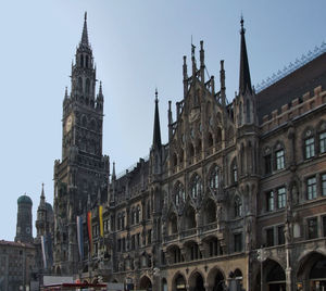 Low angle view of buildings in city against clear sky