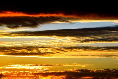 Low angle view of dramatic sky during sunset
