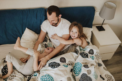 High angle view of couple sitting at home