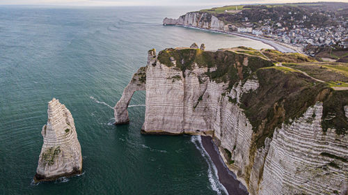 Aerial view of rock formation by sea