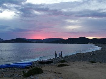 Scenic view of beach against sky during sunset