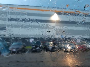 Full frame shot of wet glass window in rainy season