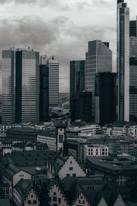 Modern buildings in city against sky