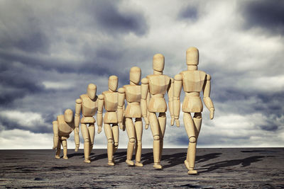 Panoramic view of beach against sky with an human evolution concept