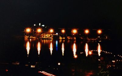 Reflection of illuminated lights in river