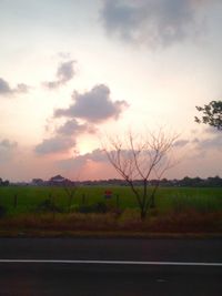 Scenic view of landscape against cloudy sky