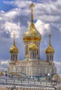 Cathedral of building against cloudy sky