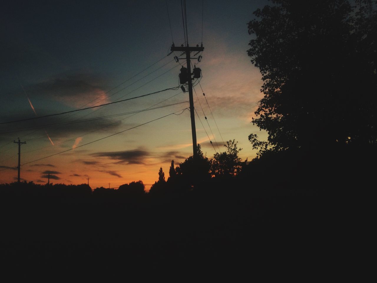 power line, electricity pylon, silhouette, electricity, power supply, sunset, cable, sky, fuel and power generation, connection, technology, tree, low angle view, tranquility, power cable, cloud - sky, nature, tranquil scene, dusk, beauty in nature