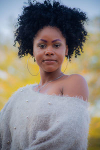 Portrait of smiling woman standing outdoors