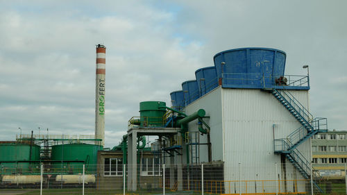 Low angle view of factory against sky