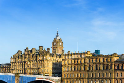 Low angle view of historical building against blue sky