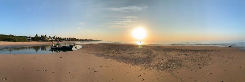 Scenic view of beach at sunset