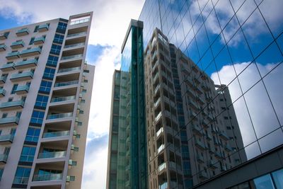 Low angle view of modern buildings against sky