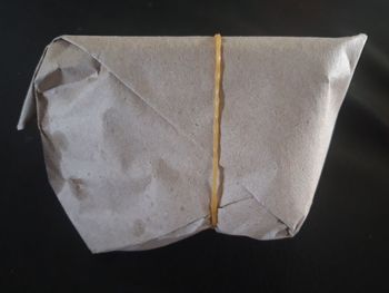 High angle view of paper against black background