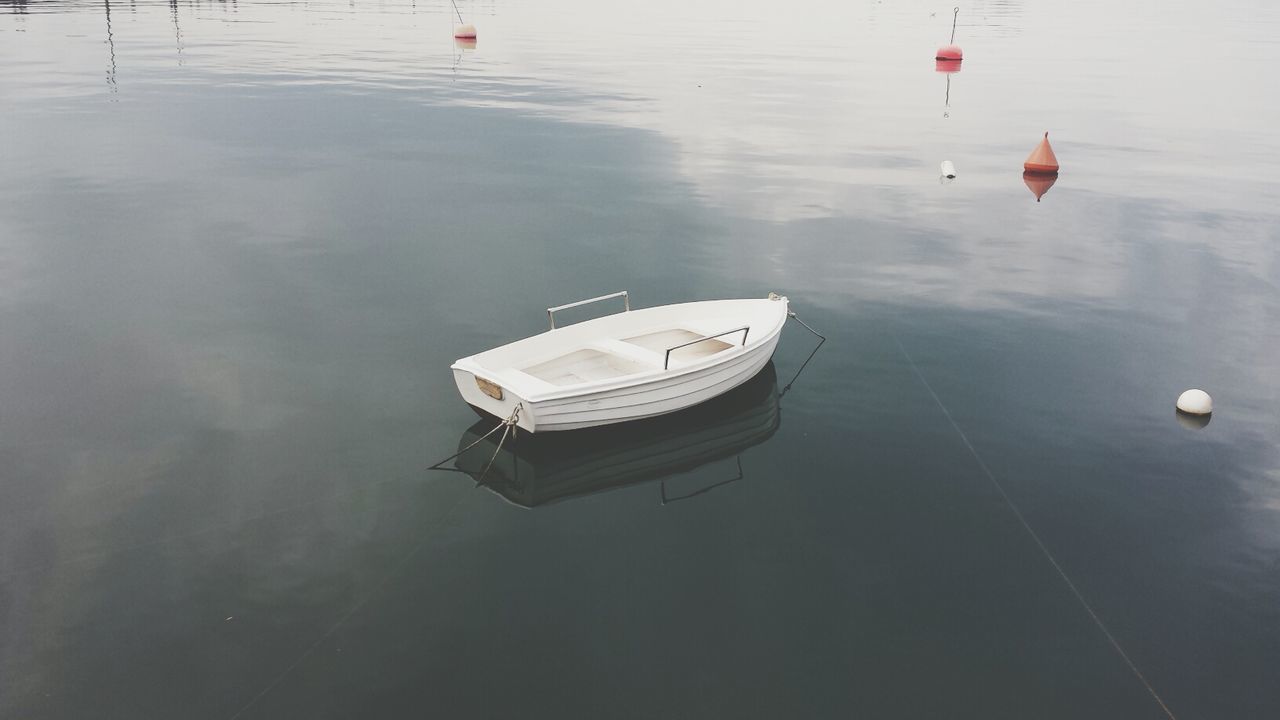 nautical vessel, water, transportation, boat, mode of transport, moored, waterfront, high angle view, reflection, sea, lake, travel, rippled, outdoors, day, nature, river, tranquility, buoy, no people