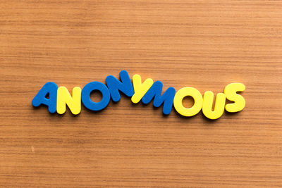 Directly above shot of text on wooden table