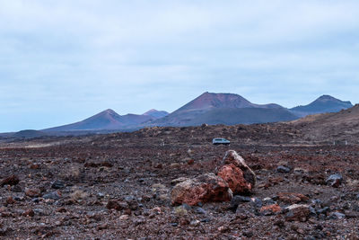 Scenic view of landscape and mountains against sky