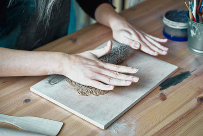 Midsection of man preparing food