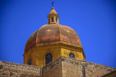 Low angle view of church against clear blue sky