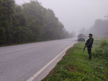 Army soldier standing by road