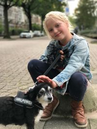 Portrait of smiling woman with dog