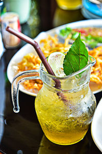 High angle view of drink by food on table