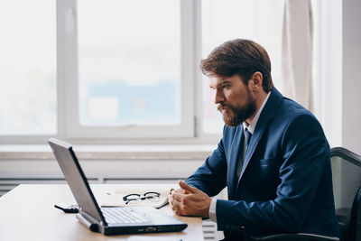 Man working on table at home