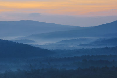 Scenic view of mountains against sky during sunset