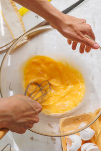 Cropped hands of person preparing food