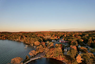 High angle view of river amidst landscape against clear sky during sunset