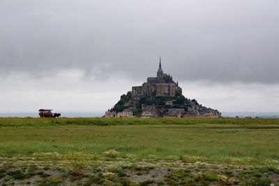 Built structure against cloudy sky