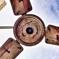 Low angle view of rusty wheel