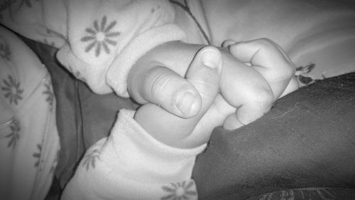 Close-up of baby sleeping on bed