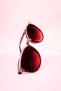 Close-up of sunglasses against white background