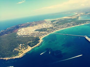 Aerial view of bay against sky