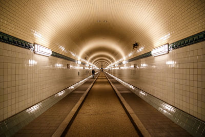 People walking in tunnel