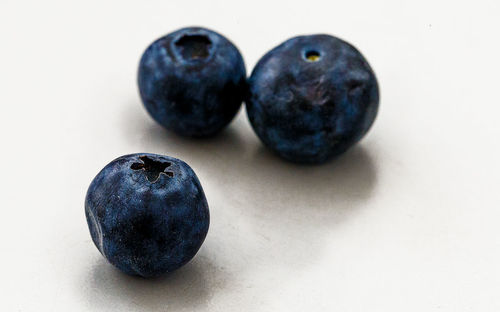 Close-up of fruit against white background